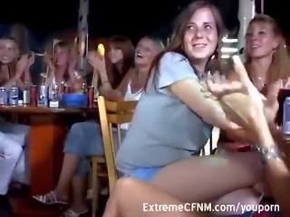 Cute Girls suck shaft in a club