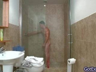 Hot muscled juvenile jerking under shower